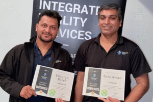 Sam Awan and Chintan Patel holding their awards.